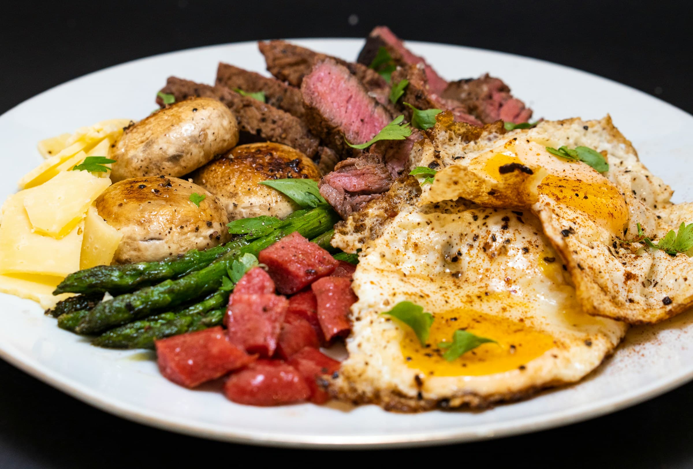 Steak, eggs, and avocado — a meal ready to log with AI photo scanning